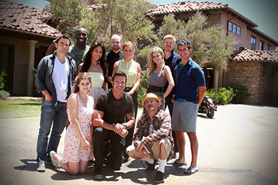 The cast of “The Joe Schmo Show” (left to right): back row standing: “Allan,” played by Rob Belushi; “Lavernius,” played by Segun Oduolowu; “Allison,” played by Nikki McKenzie; “Stan,” played by Fred Cross; “Karlee,” played by Joanna Newman; “Chloe,” played by Chelsey Crisp; “Randy,” played by Michael Weaver; and Rogan. Front row, (kneeling left to right): “Skylar,” played by Meghan Falcone; Lorenzo Lamas, as himself; and “Chico,” played by Lombardo Boyar. “The Joe Schmo Show” premieres on Spike 